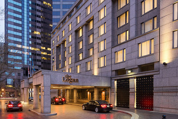 Exterior photo of the Logan Hotel in the evening.