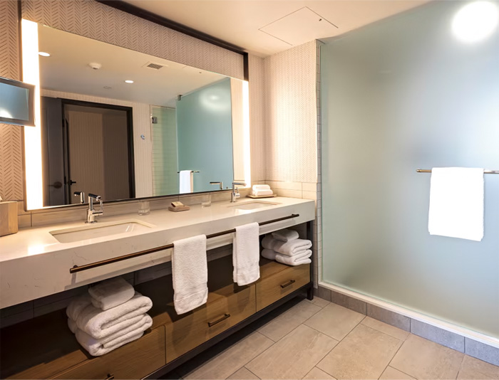 Lavish double-vanity bathroom in the Regal King Suite at River Tower at Northern Quest Resort & Casino