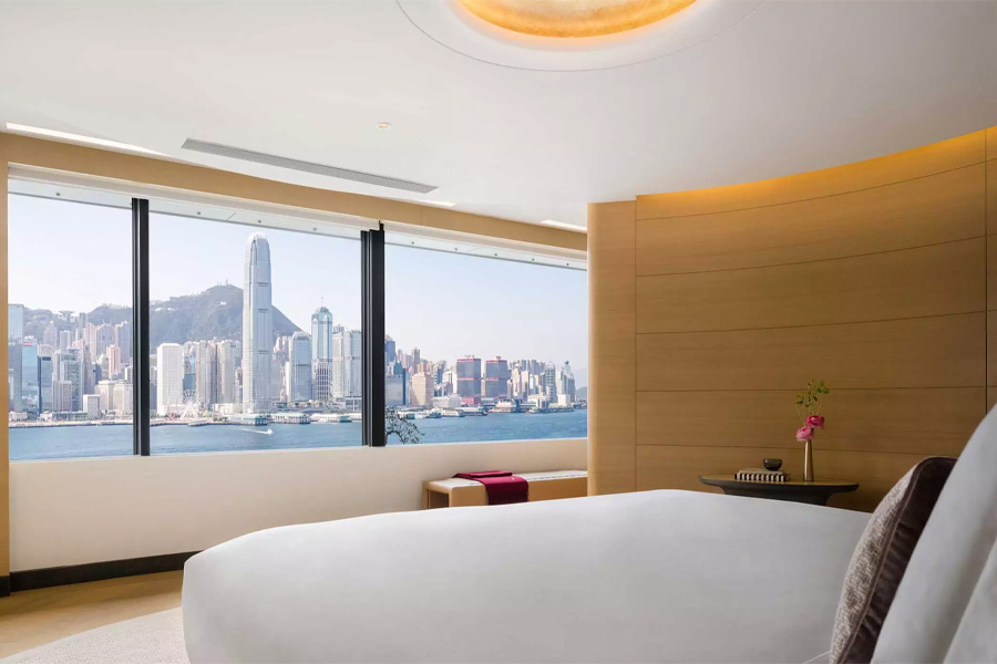 Regent Hong Kong Corner Suite Harbourview room with a view of Victoria Harbour.